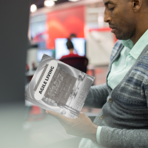 serious-black-man-reading-a-book-while-at-the-office-mockup-a14501